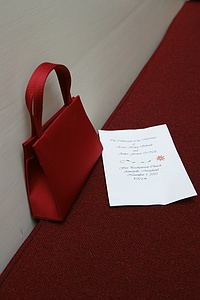 A purse with the invitation